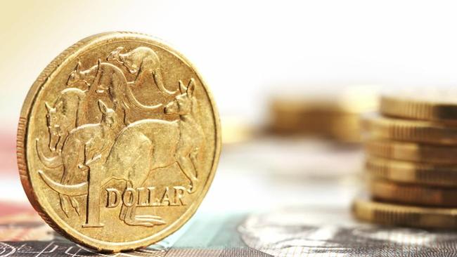 Aussie one dollar coins, on a twenty dollar note.