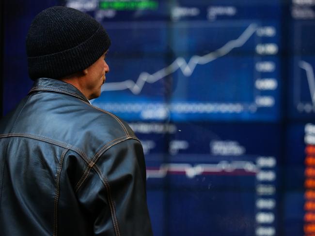 SYDNEY, AUSTRALIA - NewsWire Photos JULY 05, 2021: A member of the public is seen checking the stocks at the ASX in the CBD, as we enter week 2 of Covid-19  lockdown in Sydney Australia. Picture: NCA NewsWire / Gaye Gerard