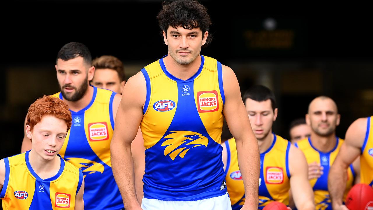 MELBOURNE, AUSTRALIA - MAY 06: Tom Barrass of the Eagles leads his team out onto the field during the round eight AFL match between Richmond Tigers and West Coast Eagles at Melbourne Cricket Ground, on May 06, 2023, in Melbourne, Australia. (Photo by Quinn Rooney/Getty Images)