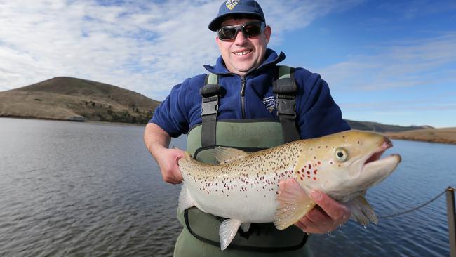 Inland Fisheries Service technical officer Brock Cuthbertson with one of the salmon released into Craigbourne Dam. Picture: RICHARD JUPE