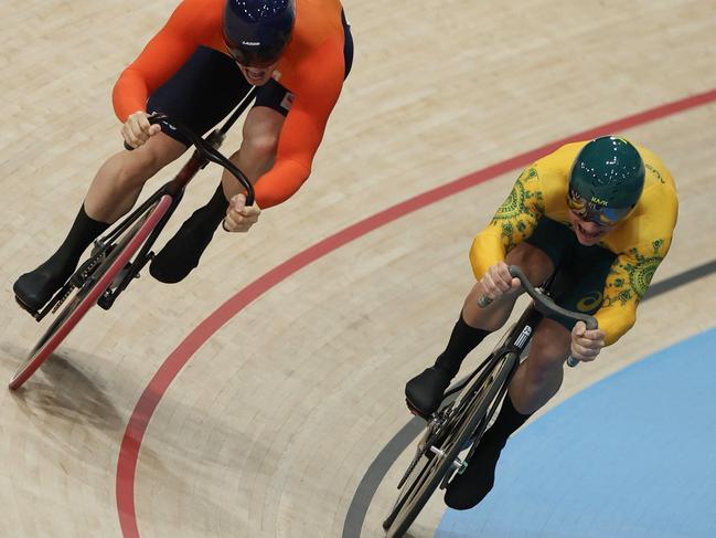 Netherlands' Harrie Lavreysen and Australia's Matthew Richardson compete in the men's track cycling sprint final race 2 for gold of the Paris 2024 Olympic Games at the Saint-Quentin-en-Yvelines National Velodrome in Montigny-le-Bretonneux, south-west of Paris, on August 9, 2024. (Photo by Thomas SAMSON / AFP)