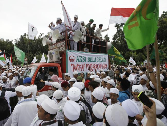 Muslim protesters calling for the arrest of Jakarta’s Chinese Christian governor.