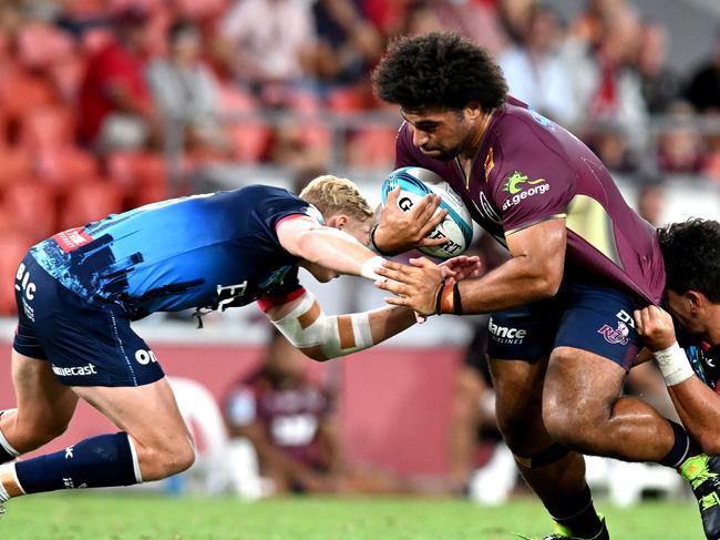 BRISBANE, AUSTRALIA - FEBRUARY 19: Zane Nonggorr of the Reds takes on the defence during the round one Super Rugby Pacific match between the Queensland Reds and the Melbourne Rebels at Suncorp Stadium on February 19, 2022 in Brisbane, Australia. (Photo by Bradley Kanaris/Getty Images)