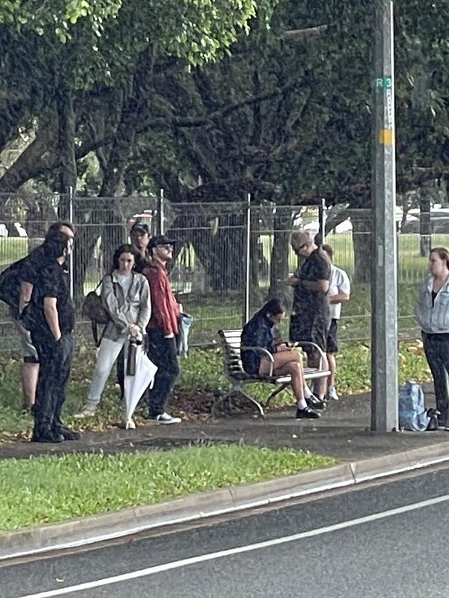 Commuters wait for a replacement bus service in Southport.