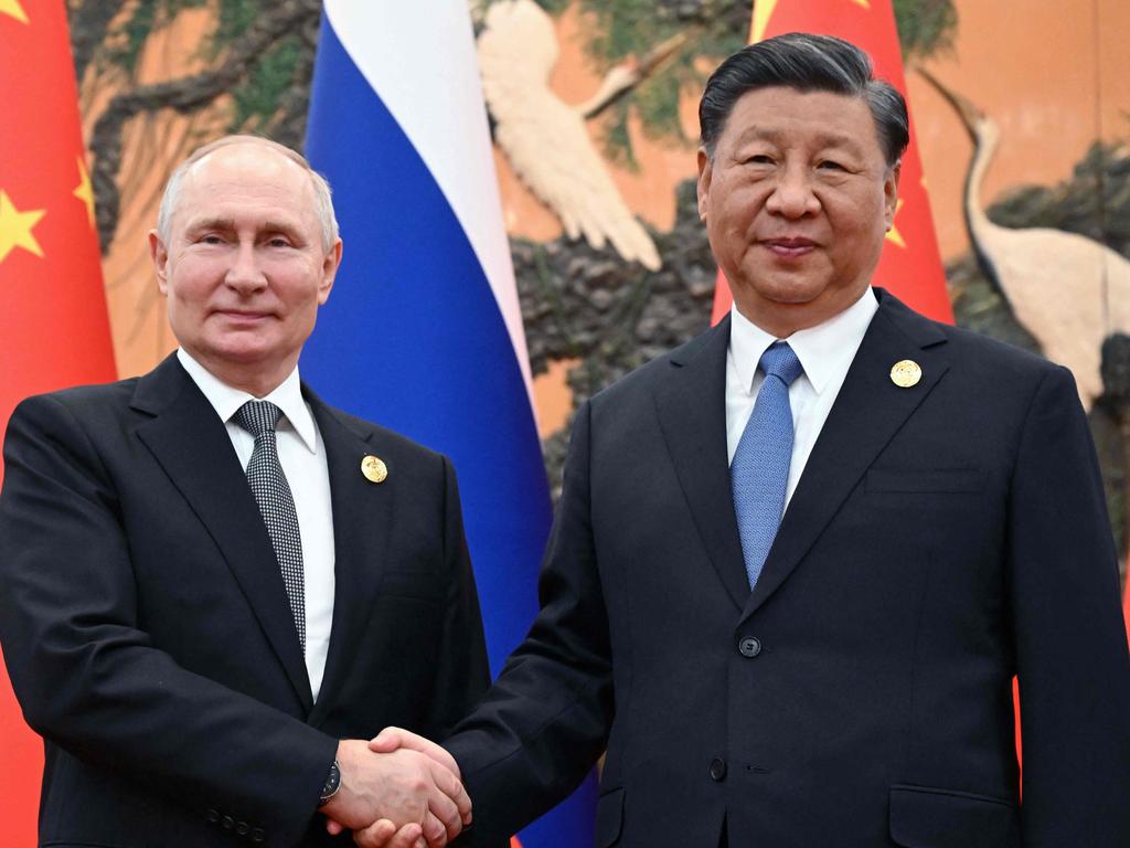 Russia's President Vladimir Putin and Chinese President Xi Jinping shaking hands during a meeting in Beijing. Picture: AFP