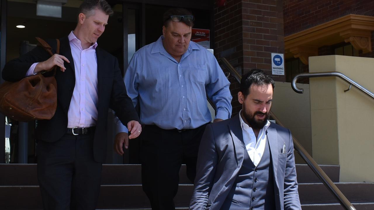 Gregory Mark Benjamin, 59, (middle, blue long sleeve shirt) leaves Mackay District Court with his legal team after pleading guilty to child grooming and possessing child exploitation material. Picture: Duncan Evans