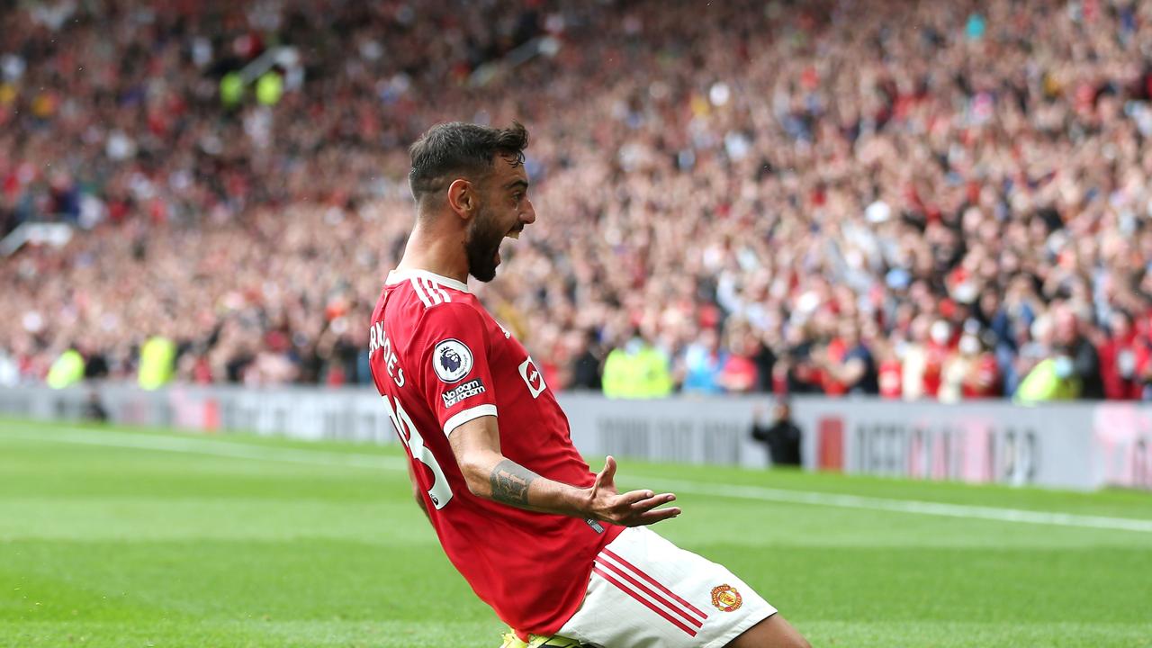 MANCHESTER, ENGLAND - AUGUST 14: Bruno Fernandes of Manchester United celebrates after scoring their side's first goal during the Premier League match between Manchester United and Leeds United at Old Trafford on August 14, 2021 in Manchester, England. (Photo by Alex Morton/Getty Images)