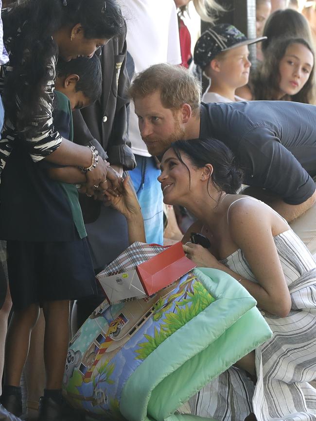 They accepted a number of gifts from the Fraser Island locals. Picture: AP Photo/Kirsty Wigglesworth, Pool