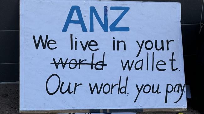 One of Paul Herman’s protest signs outside the bank at Ashgrove. Picture: Isabella Pesch