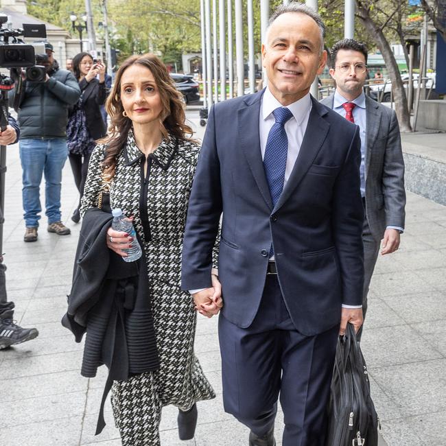 John Pesutto held his wife Betty’s hand as he arrived at court on Monday. Picture: Jake Nowakowski