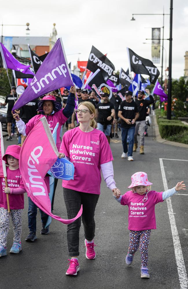 QNMU members including Morgan Slatter and daughter Charlotte (right) march in the Toowoomba Labour Day March, Saturday, May 3, 2025. Picture: Kevin Farmer
