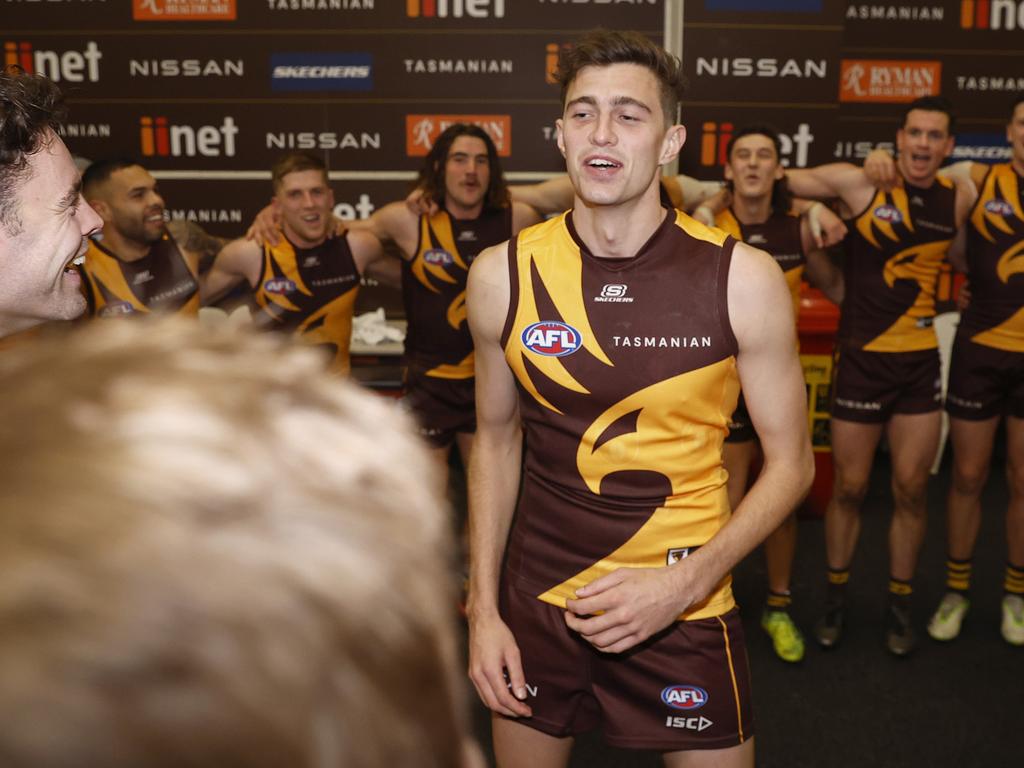 Ryan signs the team song after his first win as a Hawk. Picture: Daniel Pockett/Getty Images