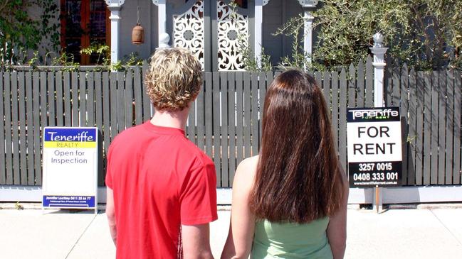 Couple outside houses for sale and for rent 30 Aug 2004. Real Estate Signs.