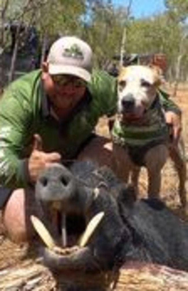 Frog Danaher and his dog with a boar he caught.