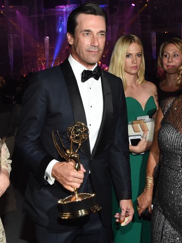 Best Actor winner Jon Hamm and fellow Mad Men cast mate January Jones at the Governor’s Ball. Picture: Rex Features/Splash News