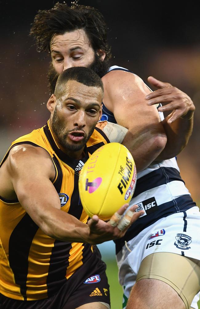 Josh Gibson and Jimmy Bartel fight for the ball.