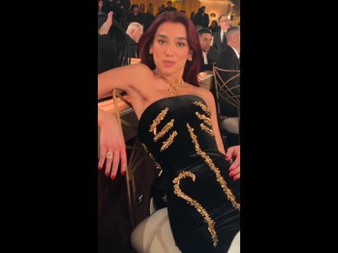 Dua Lipa couldn’t sit down in her Golden Globes dress