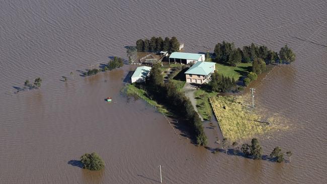 MAITLAND, AUSTRALIA - JULY 08:  Flooding is shown by helicopter on a tour of the Hunter Region by NSW Premier Dominic Perrottet and Emergency Services and Resilience and Minister for Flood Recovery Steph Cooke on July 08, 2022 around Maitland, Australia. Floodwaters have inundated the region following days of storms and heavy rains.  (Photo by David Swift-Pool/Getty Images)