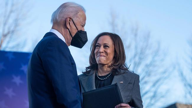 Vice President Kamala Harris (R) looks on as President Joe Biden arrives to speak about the constitutional right to vote at the Atlanta University Centre Consortium in Atlanta, Georgia.