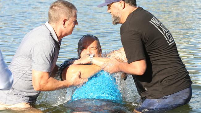 Tom Tate was baptised at Evandale Lake during a combined churches service. Rodger Baynes and Marshall Gray assist Pastor Sue Baynes (out of shot) back in 2018. Picture: Mike Batterham