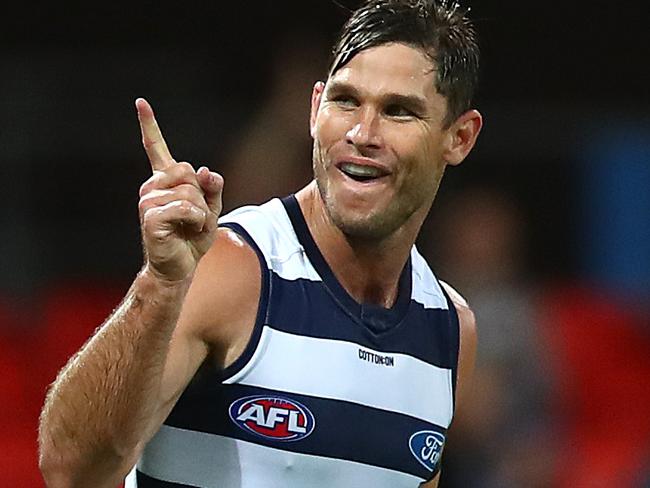 GOLD COAST, AUSTRALIA - AUGUST 14: Tom Hawkins of the Cats celebrates a goal during the round 12 AFL match between the Geelong Cats and the Port Adelaide Power at Metricon Stadium on August 14, 2020 in Gold Coast, Australia. (Photo by Jono Searle/AFL Photos/via Getty Images)