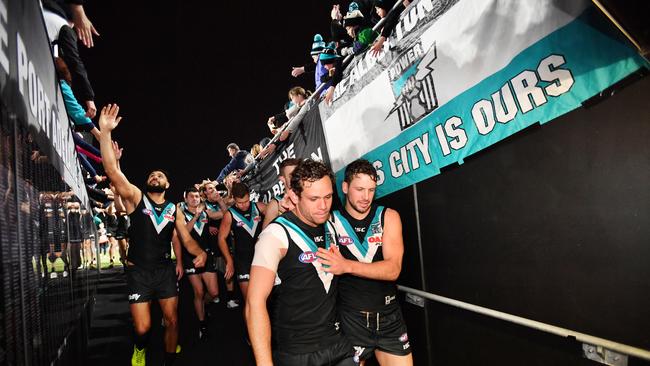 Port Adelaide’s Steven Motlop and Travis Boak walk down the race after beating St Kilda at Adelaide Oval.  Pictuer: David Mariuz/AAP