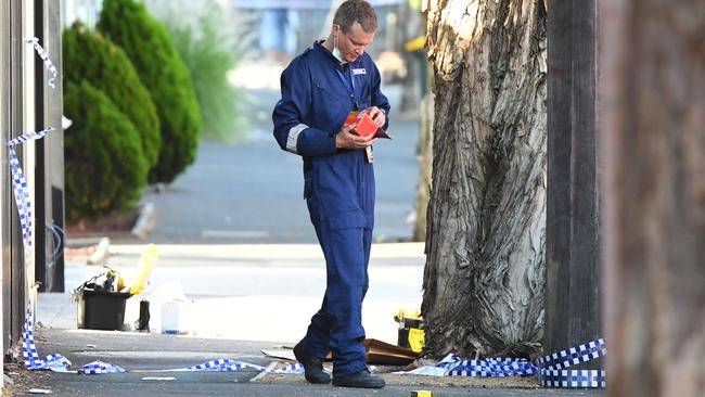 Police combed the scenes on Saturday morning.