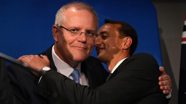 Prime Minister Scott Morrison (left) embraces Liberal candidate Dave Sharma prior to his concession speech, at the Liberal Party Wentworth by-election function in Double Bay.