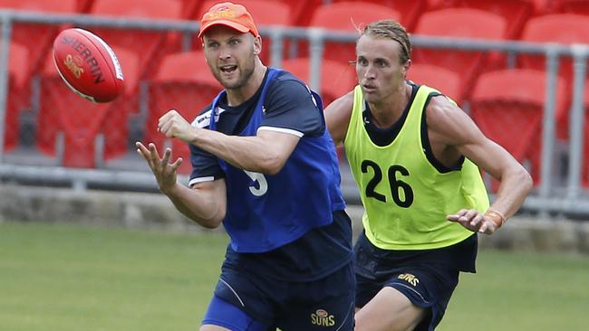 Gary Ablett gets a handball away at Gold Coast training. Picture: Jerad Williams