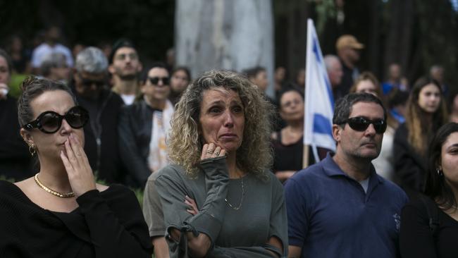 Family and friends mourn at a funeral service for Captain Arnon Moshe Avraham Benvenisti Vaspi in Rosh Pinna, Israel, on Tuesday. Picture: Getty Images