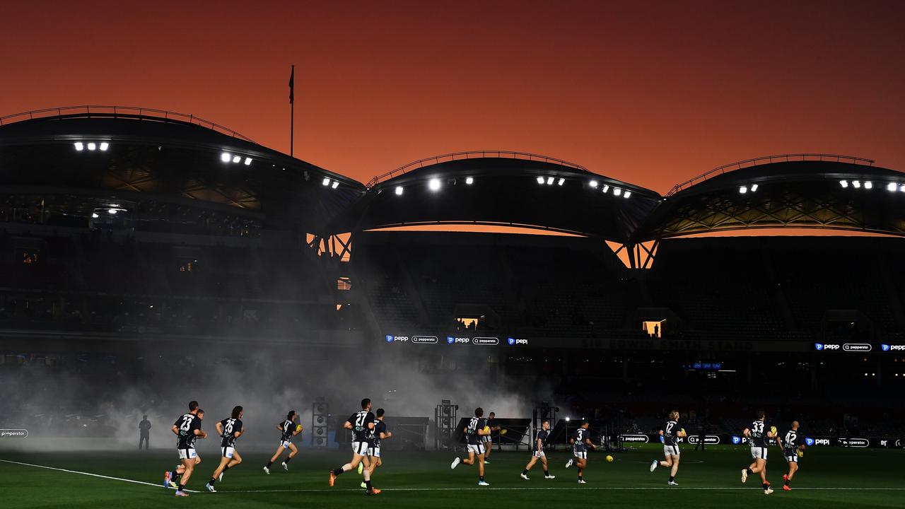 Carlton run out for warm-ups at Adelaide Oval. Photo by Mark Brake/Getty Images.