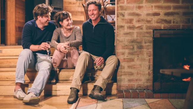 Holly and Michael Masterman, right, with their son Isaac at Friendly Beaches Lodge, which was built 30 years ago. Joan Masterman, Michael's mother, co-founded Freycinet Experience Walk, which is a four-day hike in Freycinet National Park and was a groundbreaking Tasmanian tourism initiative at the time.