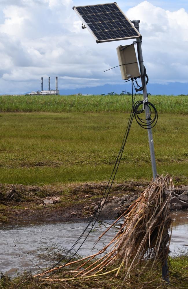 Waterlogged sugar cane in Foresthome near flood-ravaged Ingham with Wilmar Sugar Australia’s Victoria Mill in the background in the aftermath of the deadly February flood disaster. Picture: Cameron Bates