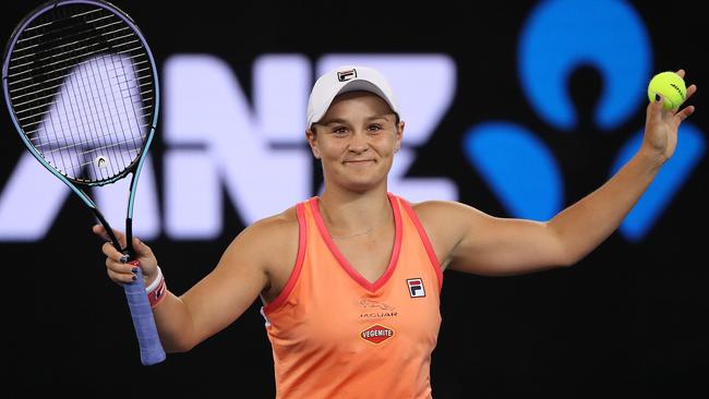 Ash Barty celebrates victory against Garbine Muguruza.