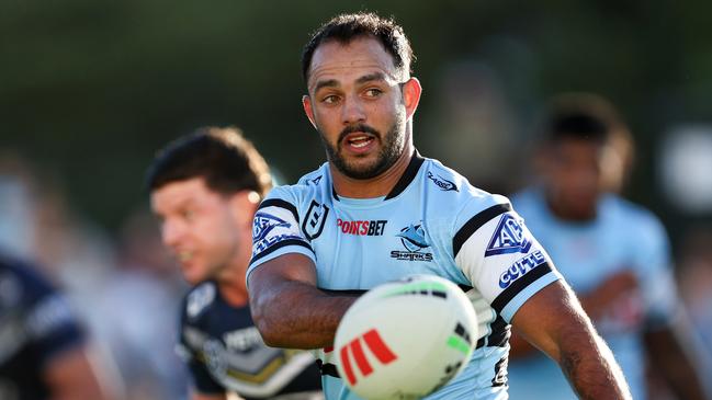 SYDNEY, AUSTRALIA - APRIL 21: Braydon Trindall of the Sharks passes the ball to a team mate during the round seven NRL match between Cronulla Sharks and North Queensland Cowboys at PointsBet Stadium, on April 21, 2024, in Sydney, Australia. (Photo by Brendon Thorne/Getty Images)