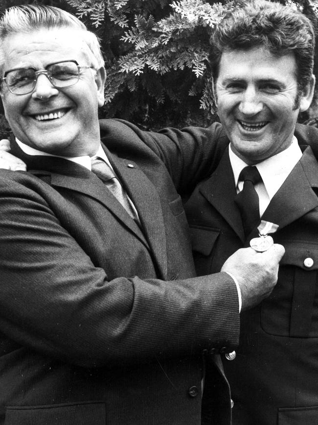 1982: Ray Koch and Sen Constable Rick Hasty with their awards, presented at Government House. 