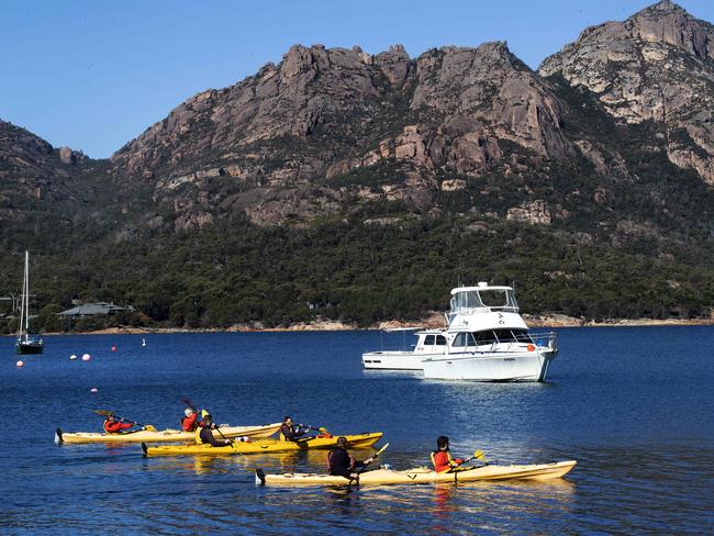 Kayakers on the water at Coles Bay. Picture: Chris Kidd