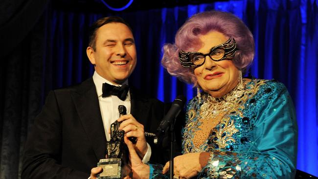 LONDON, ENGLAND - NOVEMBER 17:  David Walliams (L) accepts the Award For Comedy from Dame Edna Everage at the 59th London Evening Standard Theatre Awards at The Savoy Hotel on November 17, 2013 in London, England.  (Photo by David M. Benett/Getty Images)