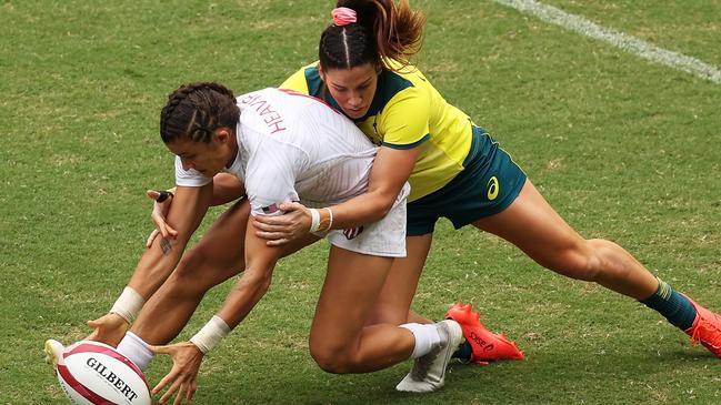 CHOFU, JAPAN - JULY 30:  Nicole Heavirland of Team United States is tackled by Charlotte Caslick of Team Australia in the WomenÃ¢â¬â¢s pool C match between Team Australia and Team United States during the Rugby Sevens on day seven of the Tokyo 2020 Olympic Games at Tokyo Stadium on July 30, 2021 in Chofu, Tokyo, Japan. (Photo by Dan Mullan/Getty Images)