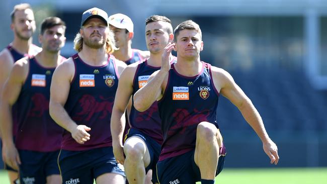 Dayne Zorko and teammates warm up during a Brisbane Lions AFL training session at The Gabba. Photo by Bradley Kanaris/Getty Images