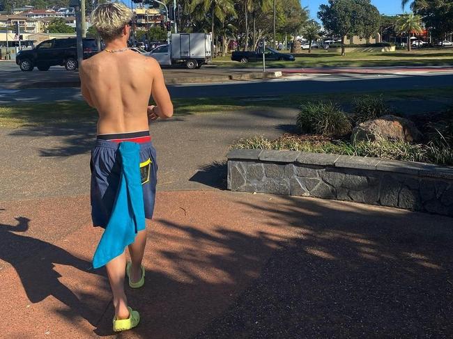 Jack Ginnivan wearing his crocs in style at the beach.