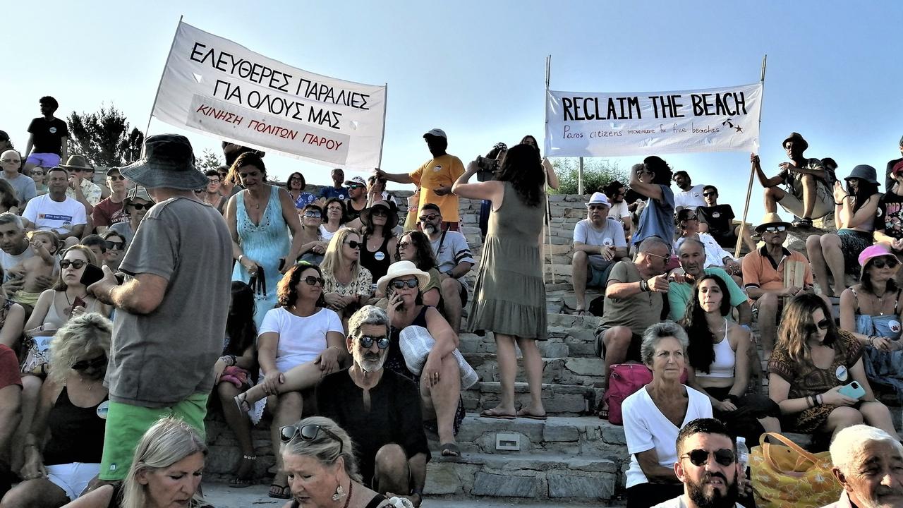 Locals on the Greek island of Paros are fighting to get free beach space back with expensive sun lounges and umbrellas marketed at tourists taking over the sand. Picture: Save Paros Beaches/Facebook