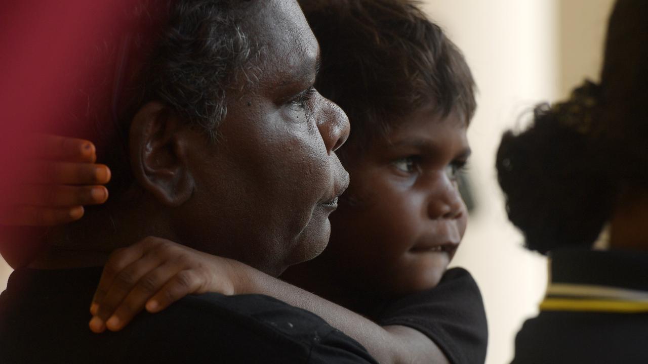 Elder Josie Davey Green holds her daughter on the steps of Darwin Supreme Court as her community gather to fight the mine's bond agreement with NTG. Picture: (A)manda Parkinson