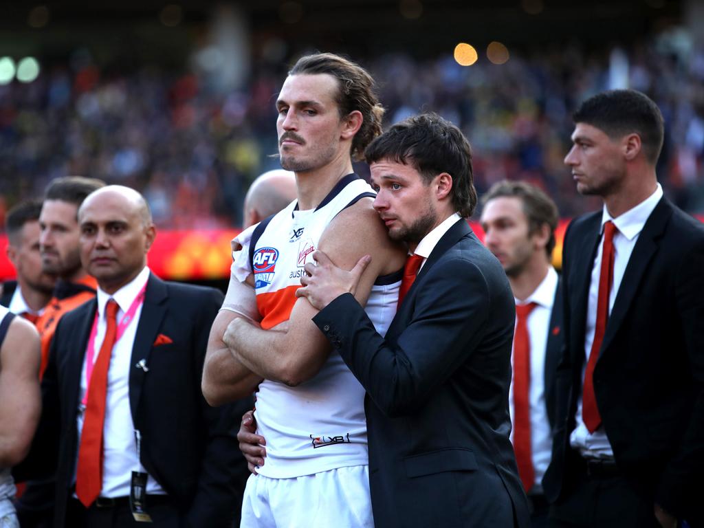 GWS Giants captain Phil Davis dejected consoled by teammate Dylan Buckley. Picture: Phil Hillyard.