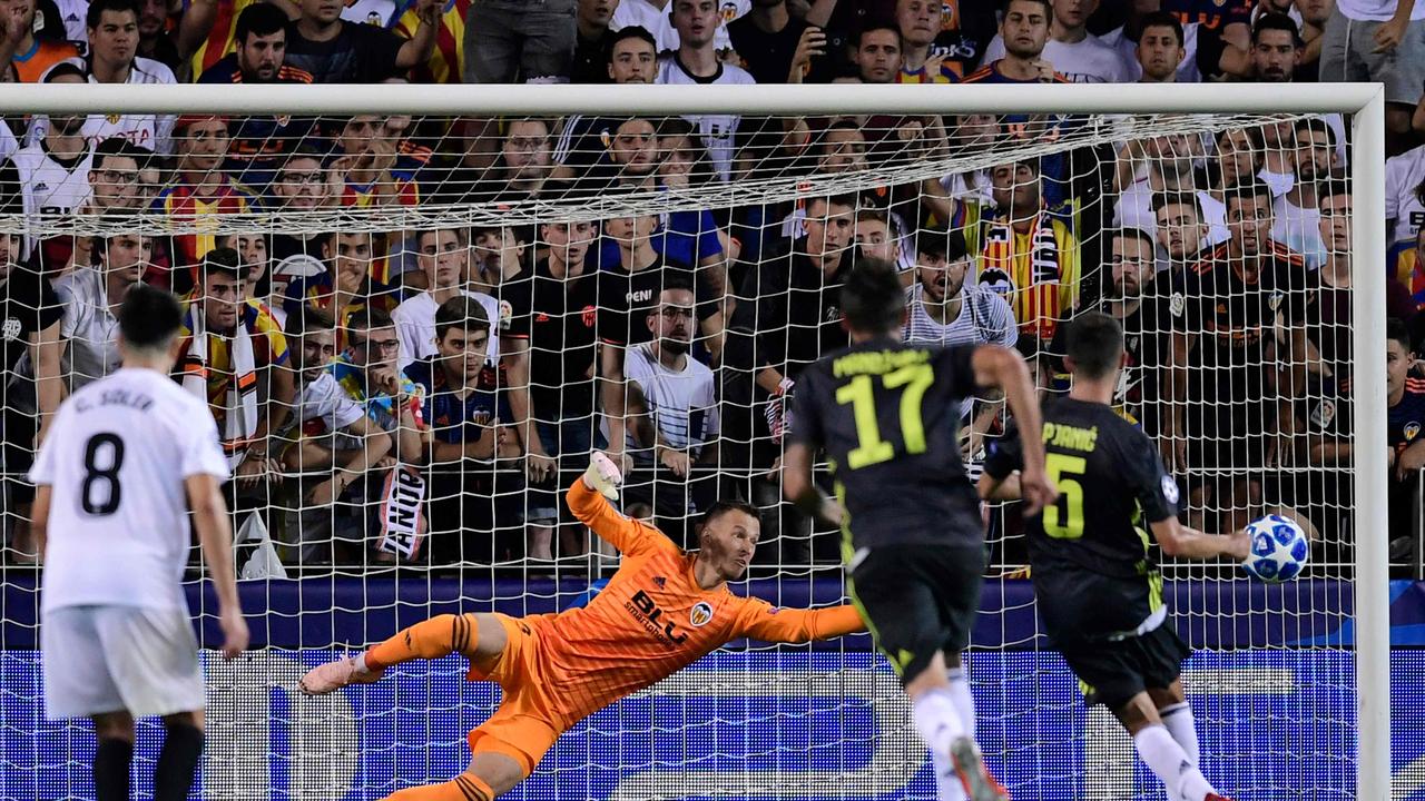 Juventus' Bosnian defender Miralem Pjanic (R) scores a penalty