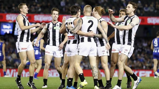 Collingwood players celebrate a goal in the Round 8 victory over North Melbourne. Picture: Getty Images