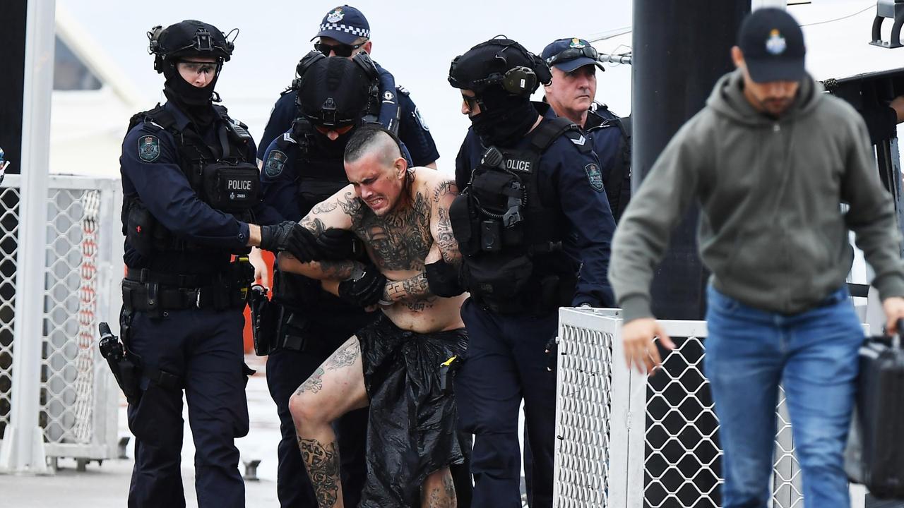 The man was struggling with police. Picture: Patrick Woods.