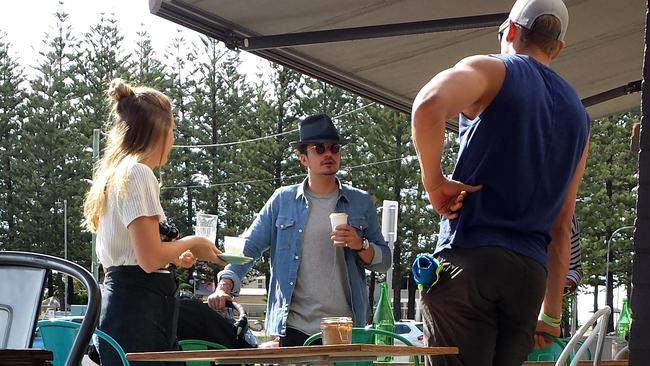 Orlando Bloom enjoys a coffee at Elk Espresso during filming of Pirates of the Caribbean