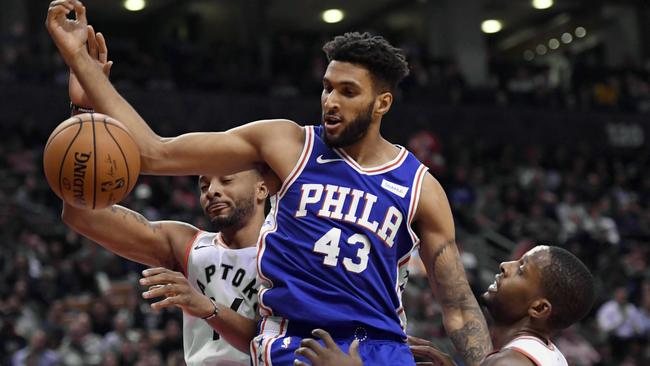 Jonah Bolden battles Toronto Raptors CJ Miles Norman Powell.