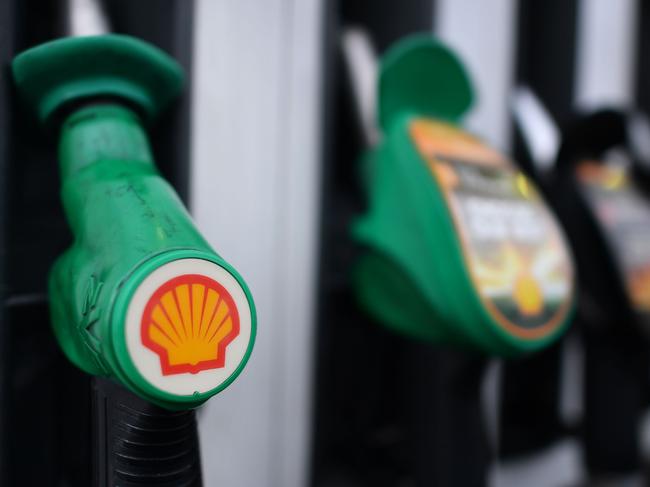 (FILES) In this file photo taken on January 30, 2018 the logo of energy giant Royal Dutch Shell is pictured on pumps at a petrol station in London. Royal Dutch Shell said on February 1, 2018 that profit after taxation almost tripled to just under $13 billion (10.5 billion euros) in 2017, energised by rising oil and gas prices.  / AFP PHOTO / BEN STANSALL